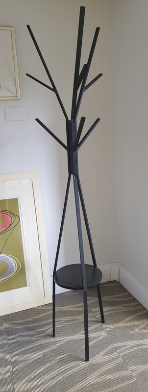 Black hat and coat stand