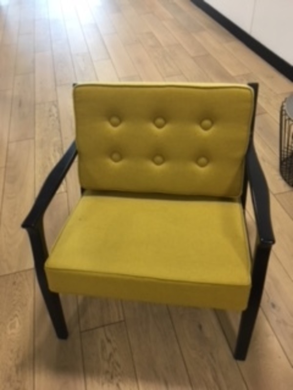 Yellow wood frame button back low armchair