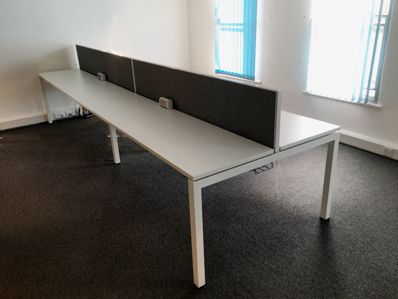 Compact 600mm deep white bench desks, per user 