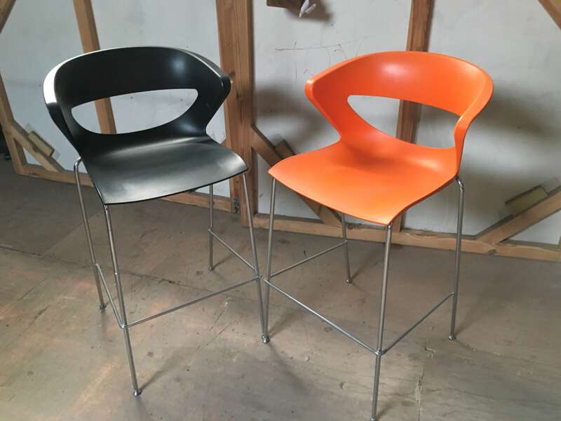 Black and orange plastic stools