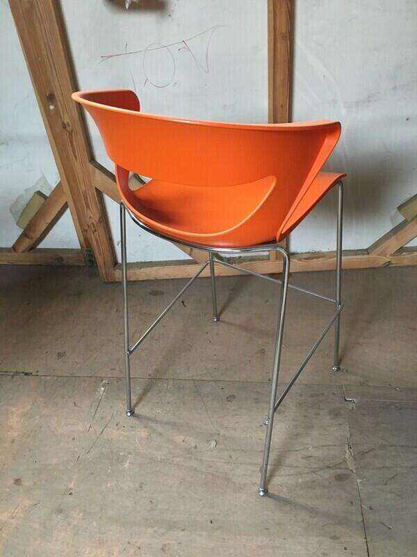 Black and orange plastic stools