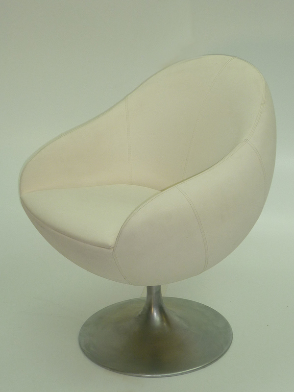 White leather look swivel reception chairs