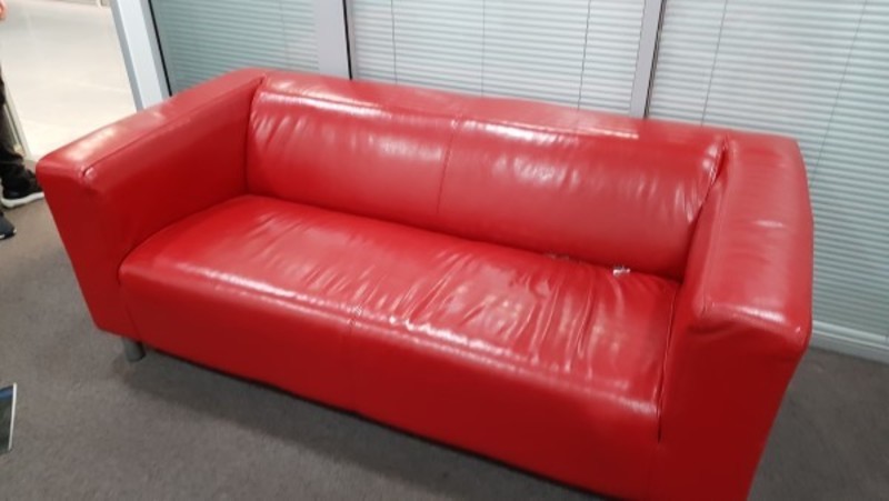 Bright red leather sofa