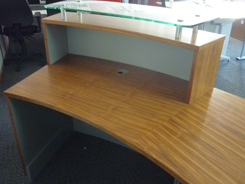 Light walnut curved reception desk