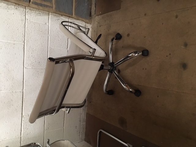 White leather Eames look-a-like operator chairs