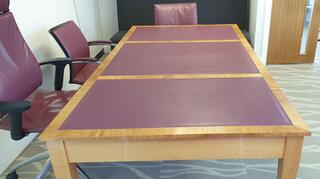 Light cherry wood with wine leather inlay table