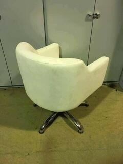 White faux leather swivel armchairs