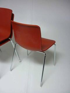 Vitra Hal Tube brick red stacking chairs